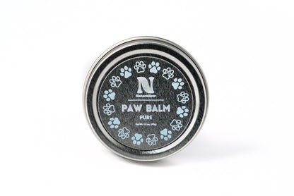 A photo of a small, circular tin with light blue paw print illustrations. Its label reads "Naturallow Paw Balm Pure. Net Weight 1.5 oz (42g)"